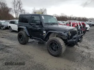 2014 Jeep Wrangler Sahara with VIN 1C4AJWBG0EL306703, listed as a Copart auction lot 51450215 with 115,932 mi miles and Salvage Title. Bid and sale history available at DreamBid. Image 4.