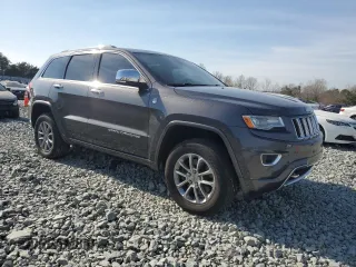 2015 Jeep Grand Cherokee Overland with VIN 1C4RJFCMXFC237723, listed as a Copart auction lot 50318145 with 103,741 mi miles and Salvage title. Bid and sale history available at DreamBid. Image 4.