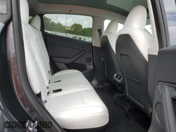 2025 Tesla Model Y Long Range with VIN 7SAYGDED6SF228626, listed as a Copart auction lot 47654525 with 2,087 mi miles and Salvage Title. Bid and sale history available at DreamBid. Image 11.