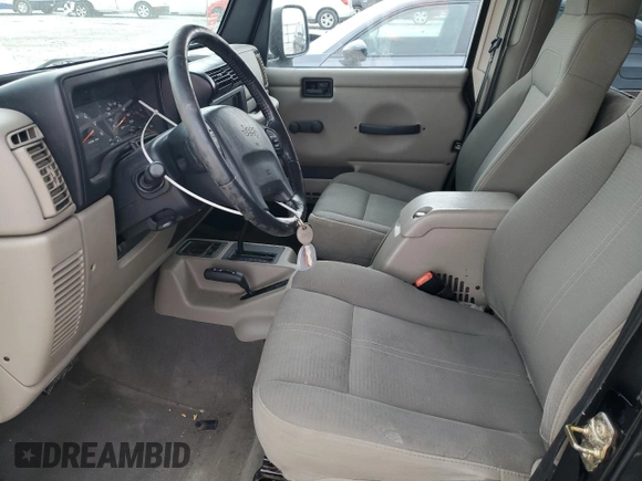 2004 Jeep Wrangler Sahara with VIN 1J4FA59SX4P713343, listed as a Copart auction lot 53608265 with 113,828 mi miles and Salvage title. Bid and sale history available at DreamBid. Image 7.