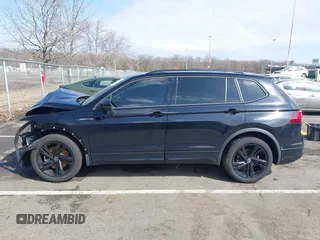 2023 Volkswagen Tiguan SE R-Line Black with VIN 3VVCB7AXXPM094621, listed as a IAAI auction lot 41737103 with 21,069 mi miles and . Bid and sale history available at DreamBid. Image 14.