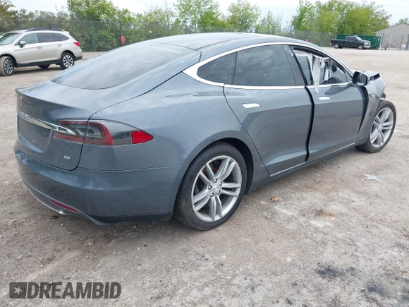 2013 Tesla Model S with VIN 5YJSA1CG9DFP27357, listed as a IAAI auction lot 42362514 with Not provided miles and . Bid and sale history available at DreamBid. Image 4.