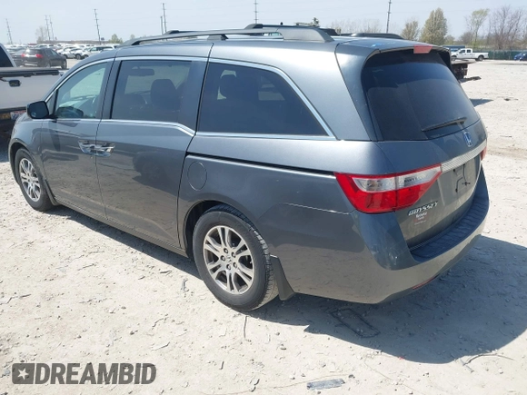 2012 Honda Odyssey EX-L with VIN 5FNRL5H69CB047425, listed as a IAAI auction lot 42064979 with 242,409 mi miles and . Bid and sale history available at carsss.com. Image 3.
