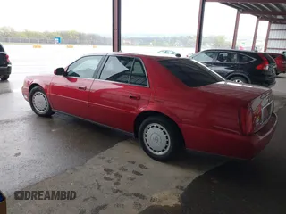 2004 Cadillac DeVille z VIN 1G6KD54Y14U144524, wystawiony jako IAAI lot #41960724 z przebiegiem Nie podano mil oraz . Historia ofert i sprzedaży dostępna na DreamBid. Obrazek 3.