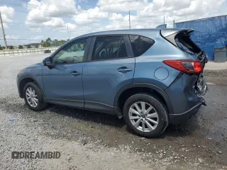 2014 Mazda CX-5 Touring with VIN JM3KE4CYXE0409558, listed as a Copart auction lot 51762995 with 91,082 mi miles and Salvage Title. Bid and sale history available at carsss.com. Image 2.