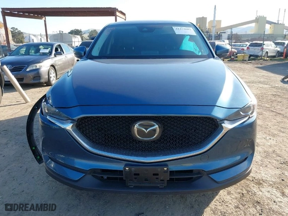 2019 Mazda CX-5 Touring with VIN JM3KFACM1K0517958, listed as a IAAI auction lot 41473681 with NaN miles. Bid and sale history available at carsss.com. Image 12.