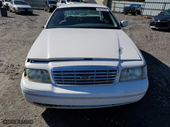 2000 Ford Crown Victoria LX with VIN 2FAFP74W0YX125595, listed as a Copart auction lot 84675434 with 151,438 mi miles and Salvage Title. Bid and sale history available at carsss.com. Image 5.