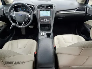 2017 Ford Fusion Hybrid Titanium with VIN 3FA6P0RU1HR138725, listed as a Copart auction lot 56650625 with 77,331 mi miles and Salvage title. Bid and sale history available at DreamBid. Image 8.