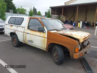 1986 Nissan Hardbody E with VIN JN6ND11S7GW015213, listed as a IAAI auction lot 42588949 with 235,145 mi miles and . Bid and sale history available at DreamBid. Image 1.
