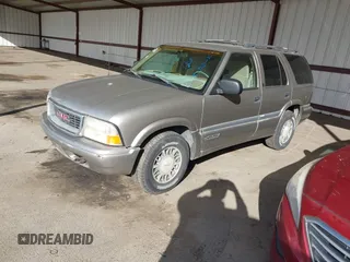 1999 GMC Jimmy SLE with VIN 1GKDT13W7X2529298, listed as a IAAI auction lot 41556249 with 114,750 mi miles. Bid and sale history available at carsss.com. Image 2.