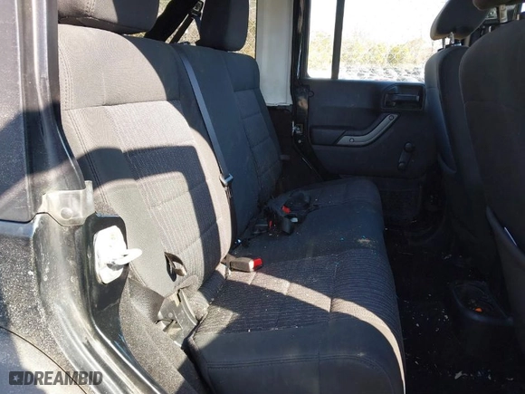 2012 Jeep Wrangler Unlimited Sport with VIN 1C4BJWDG5CL209978, listed as a IAAI auction lot 41662081 with 202,282 mi miles. Bid and sale history available at carsss.com. Image 8.