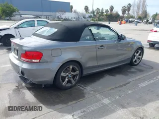 2012 BMW 1 Series 128i with VIN WBAUN1C52CVR00421, listed as a IAAI auction lot 41594256 with 107,957 mi miles and . Bid and sale history available at DreamBid. Image 4.