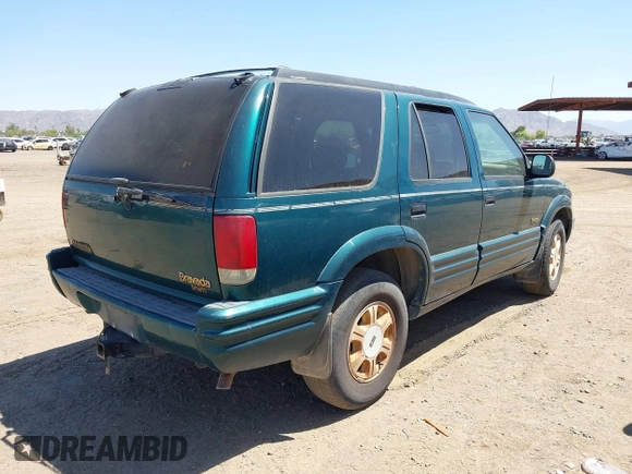 1996 Oldsmobile Bravada z VIN 1GHDT13W5T2711291, wystawiony jako IAAI lot #42502672 z przebiegiem 219 062 mil mil oraz . Historia ofert i sprzedaży dostępna na DreamBid. Obrazek 4.