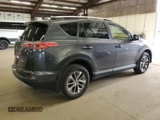 2016 Toyota RAV4 Hybrid XLE with VIN JTMRJREV0GD035203, listed as a Copart auction lot 54300225 with 153,369 mi miles and Salvage Title. Bid and sale history available at carsss.com. Image 3.