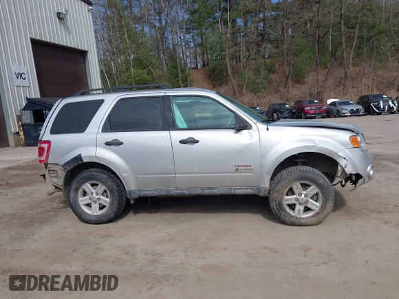 2010 Ford Escape Hybrid z VIN 1FMCU5K33AKC89835, wystawiony jako IAAI lot #41915349 z przebiegiem 125 659 mil mil oraz . Historia ofert i sprzedaży dostępna na DreamBid. Obrazek 13.