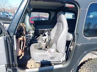 1997 Jeep Wrangler SE with VIN 1J4FY29P6VP438125, listed as a IAAI auction lot 41770455 with 163,001 mi miles. Bid and sale history available at carsss.com. Image 5.