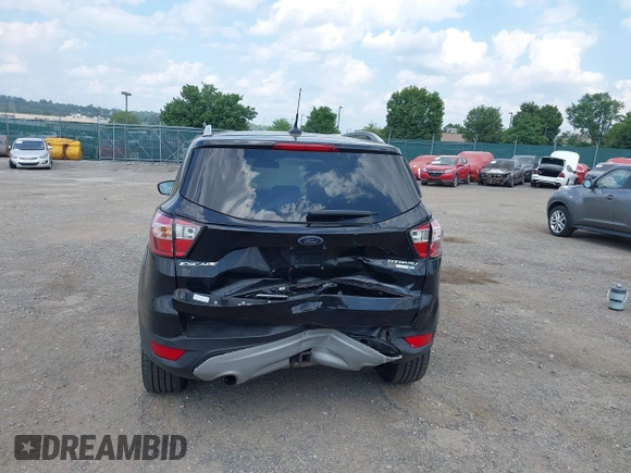 2018 Ford Escape Titanium z VIN 1FMCU9J9XJUB66275, wystawiony jako IAAI lot #42757952 z przebiegiem 97 629 mil mil oraz . Historia ofert i sprzedaży dostępna na DreamBid. Obrazek 16.