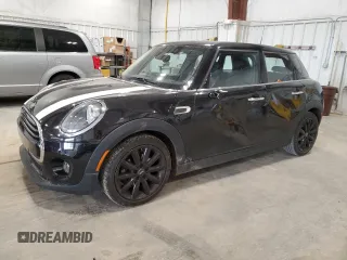 2021 MINI Hardtop 4 Door Oxford Edition with VIN WMWXU7C00M2N49230, listed as a Copart auction lot 77797914 with 51,877 mi miles and Salvage title. Bid and sale history available at DreamBid. Image 1.