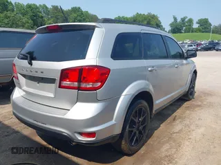 2013 Dodge Journey SXT with VIN 3C4PDDBG3DT661924, listed as a IAAI auction lot 42430211 with Not provided miles and . Bid and sale history available at DreamBid. Image 4.