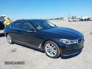 2018 BMW 7 Series 750i with VIN WBA7F0C54JGM22900, listed as a IAAI auction lot 41673673 with 66,264 mi miles. Bid and sale history available at carsss.com. Image 1.