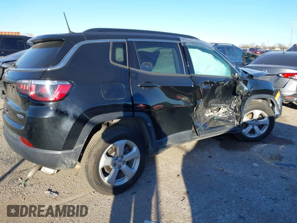 2019 Jeep Compass Latitude with VIN 3C4NJCBB1KT851846, listed as a IAAI auction lot 41219621 with 56,626 mi miles and . Bid and sale history available at DreamBid. Image 4.
