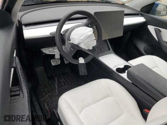 2022 Tesla Model Y Long Range z VIN 7SAYGDEE6NF318808, wystawiony jako Copart lot #57219915 z przebiegiem Nie podano mil oraz Szkoda całkowita • Salvage title. Historia ofert i sprzedaży dostępna na DreamBid. Obrazek 8.