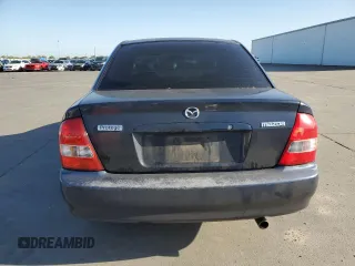 1999 Mazda Protege DX z VIN JM1BJ2227X0106522, wystawiony jako Copart lot #52423565 z przebiegiem 206 260 mil mil oraz Szkoda całkowita • Salvage title. Historia ofert i sprzedaży dostępna na DreamBid. Obrazek 6.