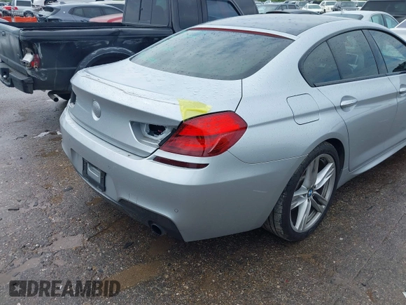 2015 BMW 6 Series 640i z VIN WBA6A0C51FD318982, wystawiony jako IAAI lot #41875547 z przebiegiem 60 968 mil mil oraz . Historia ofert i sprzedaży dostępna na DreamBid. Obrazek 18.