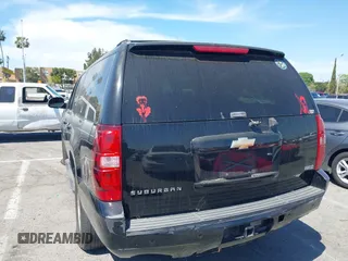 2011 Chevrolet Suburban LT with VIN 1GNSCJE0XBR285973, listed as a IAAI auction lot 42007844 with 252,994 mi miles. Bid and sale history available at carsss.com. Image 3.