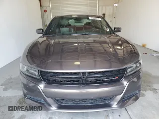 2020 Dodge Charger SXT z VIN 2C3CDXBG1LH116252, wystawiony jako Copart lot #55725565 z przebiegiem 95 039 mil mil oraz Czysty tytuł • Clean title. Historia ofert i sprzedaży dostępna na DreamBid. Obrazek 5.