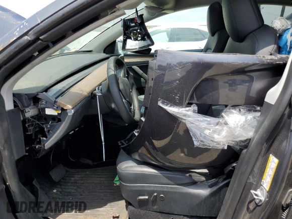 2023 Tesla Model Y Long Range with VIN 7SAYGDEE4PF899390, listed as a Copart auction lot 54361685 with Not Provided miles and Clean Title. Bid and sale history available at DreamBid. Image 7.