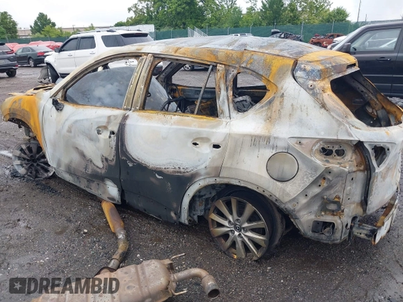 2016 Mazda CX-5 Touring z VIN JM3KE4CY7G0620106, wystawiony jako IAAI lot #42372653 z przebiegiem Nie podano mil oraz . Historia ofert i sprzedaży dostępna na DreamBid. Obrazek 14.