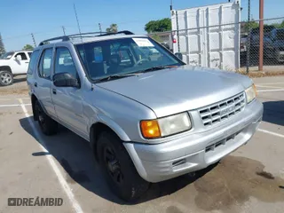 1998 Isuzu Rodeo S with VIN 4S2CM58WXW4325350, listed as a IAAI auction lot 42084411 with 292,784 mi miles. Bid and sale history available at carsss.com. Image 1.