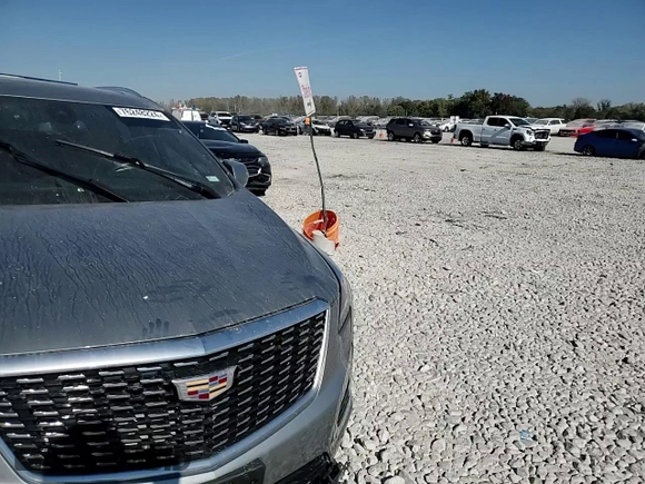 2023 Cadillac XT5 FWD Premium Luxury with VIN 1GYKNCRS6PZ100071, listed as a Copart auction lot 76248224 with 25,613 mi miles and Salvage Title. Bid and sale history available at carsss.com. Image 12.
