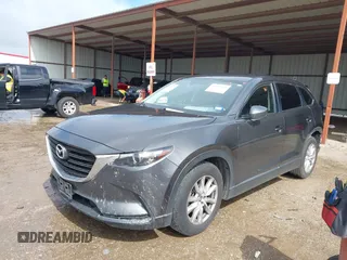 2016 Mazda CX-9 Sport with VIN JM3TCABY5G0122478, listed as a IAAI auction lot 42115795 with 134,980 mi miles and . Bid and sale history available at DreamBid. Image 2.
