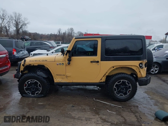 2013 Jeep Wrangler Rubicon 10th Anniversary with VIN 1C4BJWCG5DL688504, listed as a IAAI auction lot 41797184 with 109,414 mi miles and . Bid and sale history available at DreamBid. Image 14.