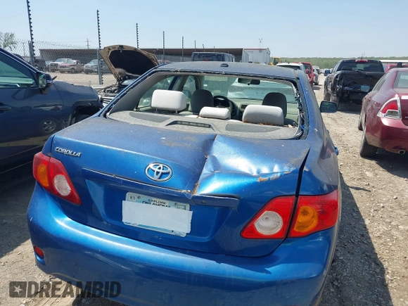 2009 Toyota Corolla with VIN JTDBL40E799044489, listed as a IAAI auction lot 42053660 with 186,356 mi miles. Bid and sale history available at carsss.com. Image 6.