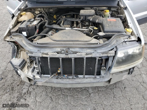2004 Jeep Grand Cherokee Laredo with VIN 1J4GX48S64C151124, listed as a Copart auction lot 52669445 with 152,970 mi miles and Salvage Title. Bid and sale history available at carsss.com. Image 12.