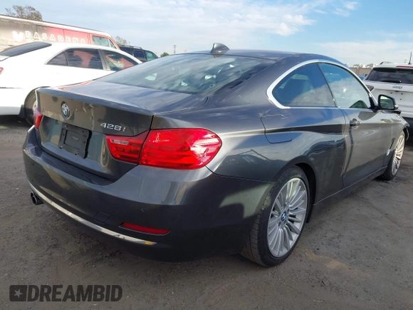2014 BMW 4 Series 428i with VIN WBA3N7C5XEF719384, listed as a IAAI auction lot 41694678 with 115,517 mi miles and . Bid and sale history available at carsss.com. Image 4.