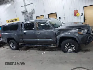 2016 Toyota Tacoma SR5 with VIN 3TMDZ5BNXGM009423, listed as a IAAI auction lot 41008068 with 107,426 mi miles and . Bid and sale history available at DreamBid. Image 13.