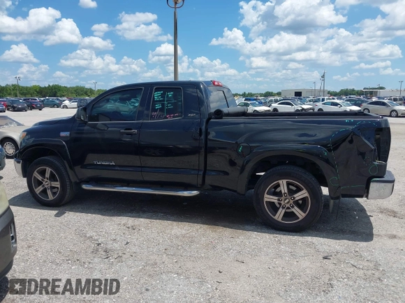 2012 Toyota Tundra z VIN 5TFRY5F17CX128888, wystawiony jako IAAI lot #42508395 z przebiegiem 279 524 mil mil oraz . Historia ofert i sprzedaży dostępna na DreamBid. Obrazek 14.