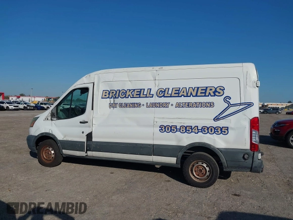 2015 Ford Transit Cargo with VIN 1FTNE2CM9FKA64133, listed as a IAAI auction lot 41312926 with 117,176 mi miles and . Bid and sale history available at carsss.com. Image 14.
