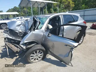 2014 Mazda CX-5 Touring z VIN JM3KE4CY6E0306444, wystawiony jako Copart lot #53542135 z przebiegiem Nie podano mil oraz Szkody całkowita. Historia ofert i sprzedaży dostępna na DreamBid. Obrazek 1.