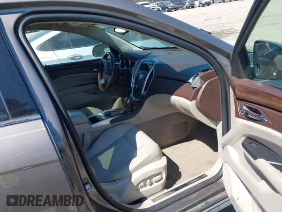 2012 Cadillac SRX Luxury Collection with VIN 3GYFNAE36CS509456, listed as a IAAI auction lot 41833647 with 119,931 mi miles and . Bid and sale history available at carsss.com. Image 5.