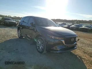 2023 Mazda CX-5 Signature with VIN JM3KFBXY1P0122544, listed as a Copart auction lot 83712034 with 27,032 mi miles and Salvage Title. Bid and sale history available at DreamBid. Image 12.