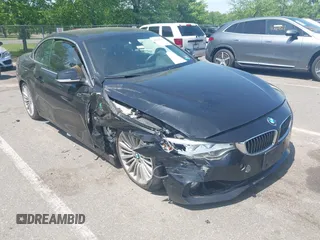 2015 BMW 4 Series 428i xDrive z VIN WBA3T1C55FP820444, wystawiony jako IAAI lot #42183187 z przebiegiem 102 672 mil mil oraz . Historia ofert i sprzedaży dostępna na DreamBid. Obrazek 1.