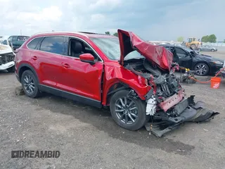 2023 Mazda CX-9 Touring z VIN JM3TCBCY9P0648567, wystawiony jako IAAI lot #42233566 z przebiegiem 33 137 mil mil oraz . Historia ofert i sprzedaży dostępna na DreamBid. Obrazek 1.