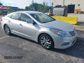 2014 Hyundai Azera with VIN KMHFG4JG9EA341354, listed as a IAAI auction lot 42711386 with 144,157 mi miles and . Bid and sale history available at DreamBid. Image 1.