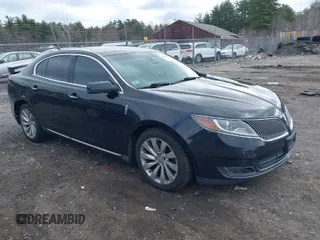 2014 Lincoln MKS with VIN 1LNHL9EK0EG601444, listed as a IAAI auction lot 41849160 with 164,791 mi miles. Bid and sale history available at carsss.com. Image 1.