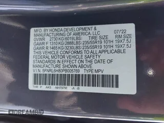 2023 Honda Odyssey Touring with VIN 5FNRL6H80PB005769, listed as a IAAI auction lot 41280858 with 7,041 mi miles and . Bid and sale history available at DreamBid. Image 9.
